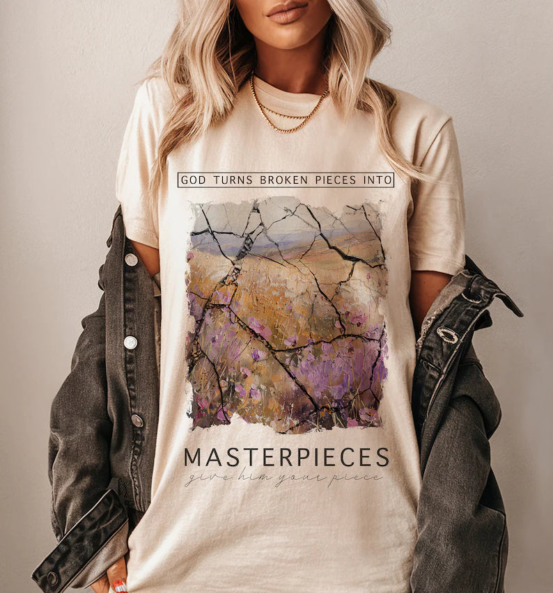 God Turns Broken Pieces Into Masterpieces Cream Tee